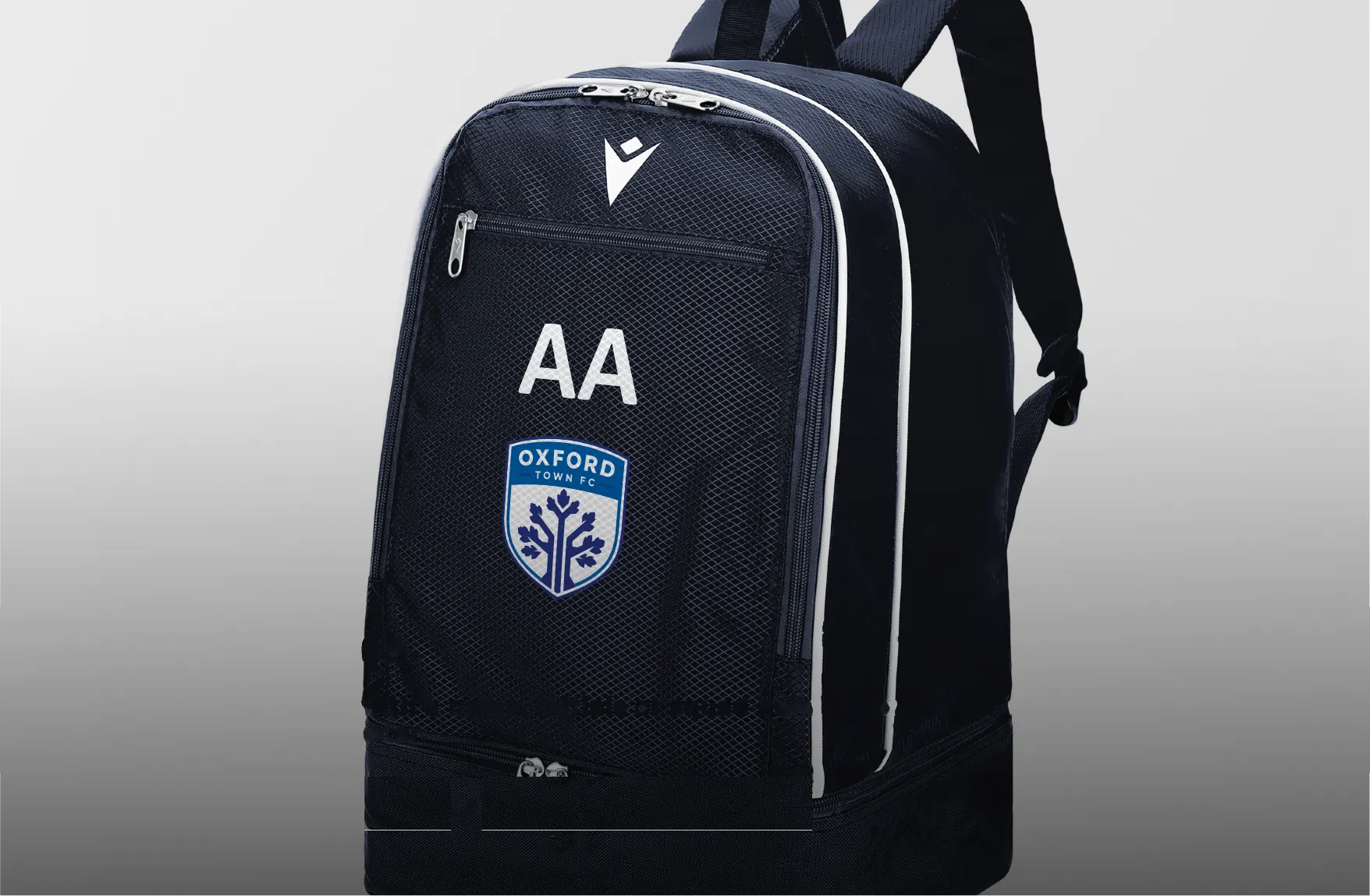 Navy Macron backpack personalised with initials and a club crest